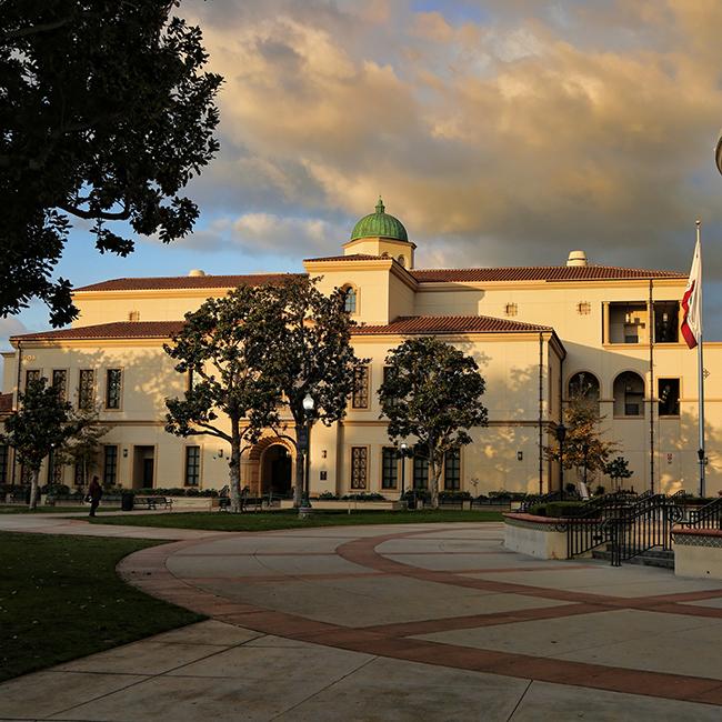 Sunset casts an orange glow on Fullerton College's Science Building at sunset.